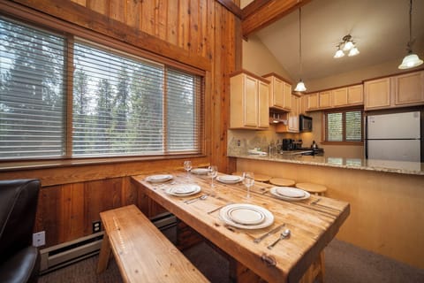 Gather around your rustic wooden dining table for memorable meals, with a fully equipped kitchen ready for your culinary adventures.