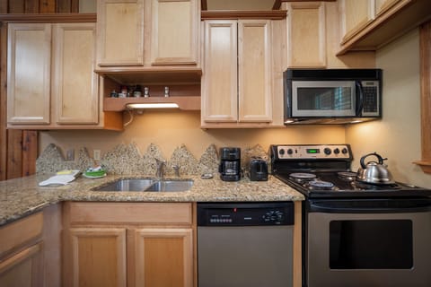 Your fully equipped kitchen features granite countertops, quality appliances, and ample cabinet space for preparing your favorite meals.