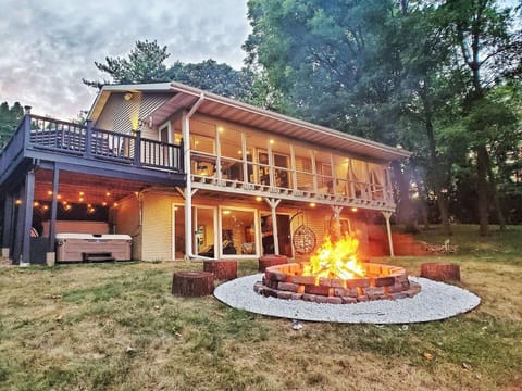 Escape to tranquility! ✨ Discover a serene vacation rental home featuring a blazing fire pit , an inviting deck, and the soothing embrace of nature. Enjoy S'mores and share stories while gathered around this huge fire pit!