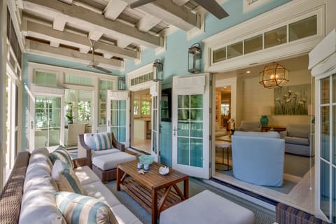 Back porch with french doors open to living area. Pool is to the rear of this