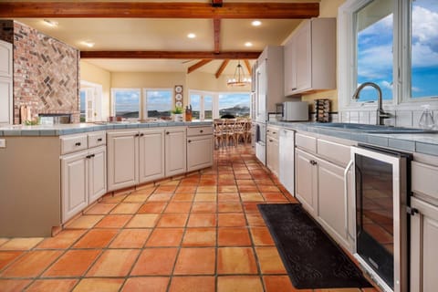 There is a large, fully stocked kitchen that is fun to cook in for a crowd and the living spaces are large and comfortable for all to share.  -Bridget