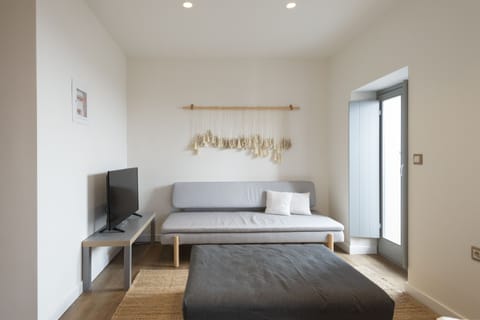 Superior Suite | Living area | Flat-screen TV