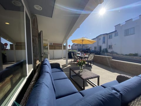 2 houses to the sand.  Lots of dining space and Gas BBQ