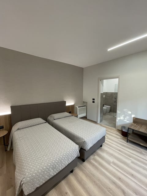 Twin Room | Minibar, in-room safe, desk, soundproofing