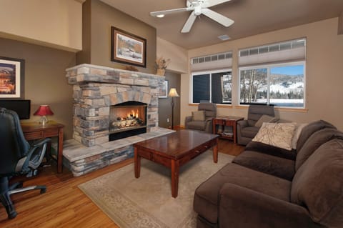 Main level living area with smart TV and gas fireplace.