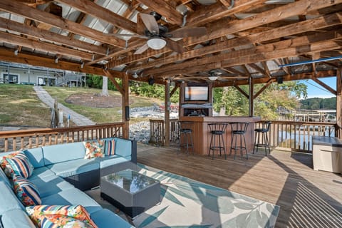 Welcome to Sun Kissed Cove. Covered dock with bar, TV and sectional perfect to enjoy all day.