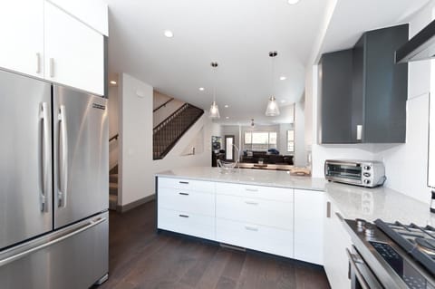 Kitchen looking into Dining and Main Living Spaces