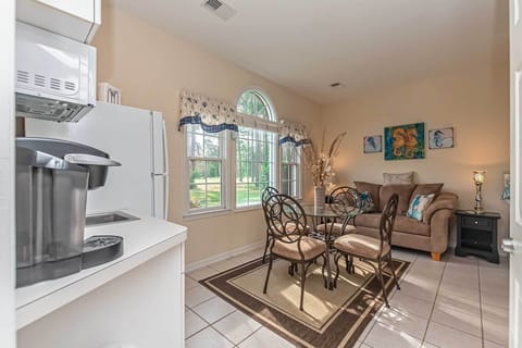 Dinette set and loveseat in kitchenette area