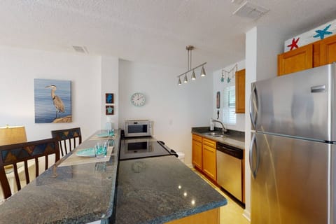 Fully Equipped Kitchen with Stainless Appliances, Granite Counters, and Bar Seating