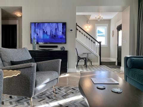 Sun drenched living room with 55" smart TV with Samsung Plus TV and Sonos.