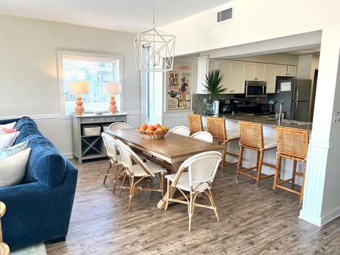 Bar area looks into the kitchen and seats 4.
