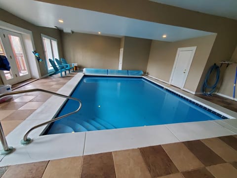 Heated Pool 18x22 lower area: pool seating, deck access, Amazon Alexa  1/2 bath.