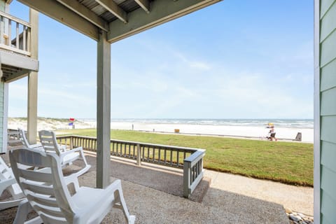 Unwind on your beachfront patio with rocking chairs perfectly positioned to soak in endless ocean views and coastal breezes.