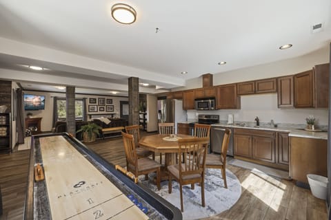 Vaulted Dining Area With Artisan Lighting And Natural Wood Finishes