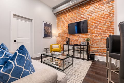 Open concept living, kitchen, and dining area with plenty of seating for you and your guests. 55” Samsung Smart 4K TV with streaming options and DIRECTV Entertainment. Dining table for two, and a sofa that converts to a full-size sleeper!