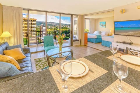 1 bedroom condo with beautiful mountain and city views, living room with open kitchen, window AC and reclining sleeper sofa, bedroom with 1 queen size and 1 full size bed.