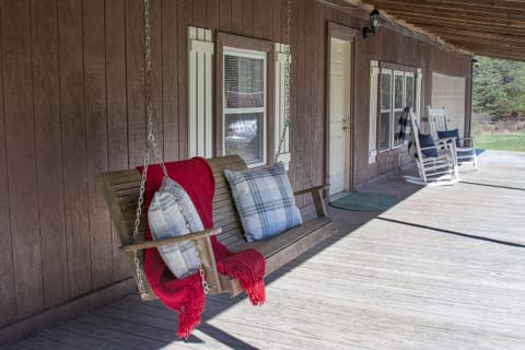 Front porch, with porch seating and rocking chairs.