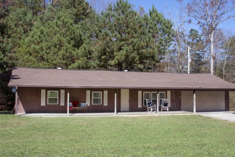 Large full length porch, with open yardage on three sides of the home