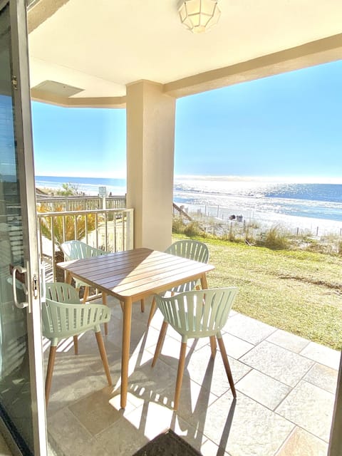 Covered patio steps to beach 