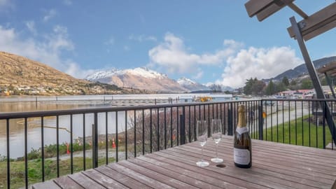 Deck with lake and mountain views