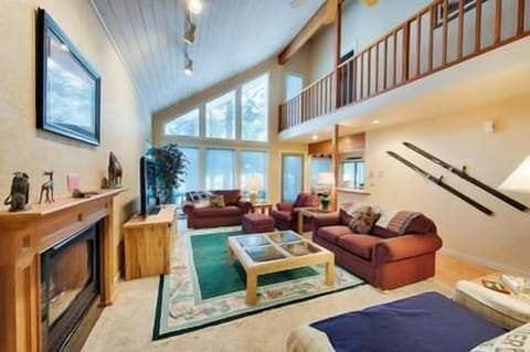 Living room and kitchen access to deck and backyard.