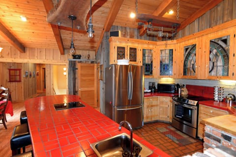 Spacious kitchen is fully stocked with large island.
