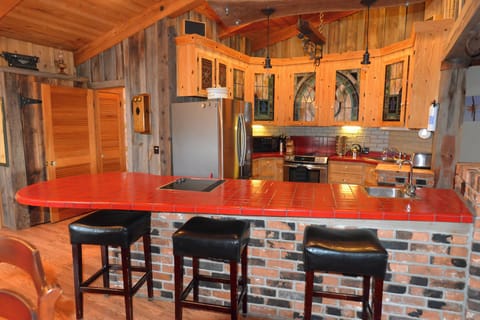Spacious kitchen is fully stocked with large island.