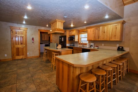 Kitchen with doors to half bath and laundry room.