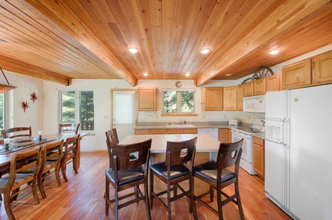 Well lit kitchen. Nice work space and counter seating.