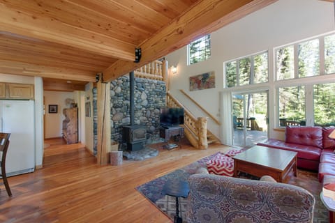 Living room has lovely forest views.