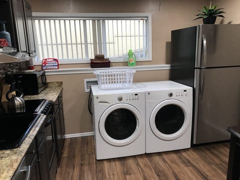 The kitchen has a large capacity w/d, & full size refrigerator.