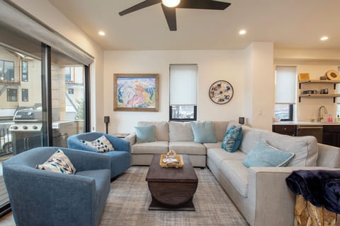 Sink into the plush sectional sofa and unwind in your stylish living space, where modern comfort meets thoughtful design details.
