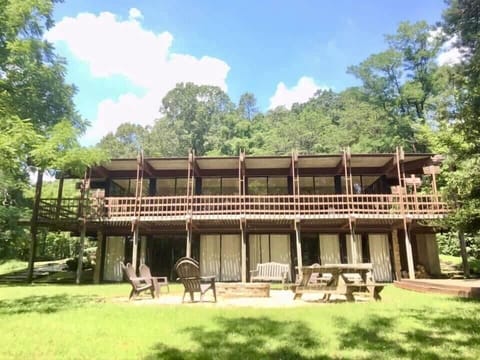 Back of Geneva Lodge. Wrap around deck, Large Fire Pit, and chapel area.