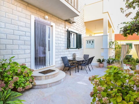 Plant, Building, Property, Furniture, Window, Flowerpot, Chair, Lighting, Shade, Architecture