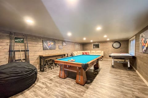 Cozy game room retreat with billiards, air hockey, and plenty of space to unwind.