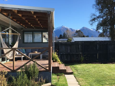 Back deck with lounge suit and mountain view. There is now a bbq 