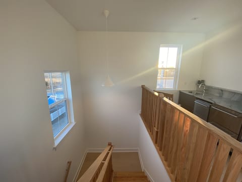 Upper galley kitchen leading to outdoor roof deck.