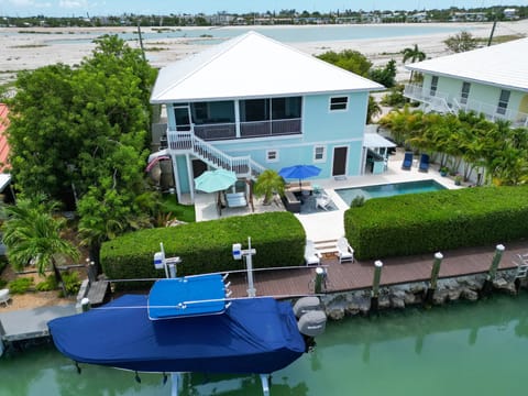 Enjoy the ultimate Florida Keys lifestyle with a private pool, canal frontage, and tropical landscaping just steps from the water.