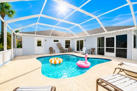 Your private screened pool awaits—dive in, float on sunny afternoons, and soak up Florida's endless blue skies right from your own backyard oasis.