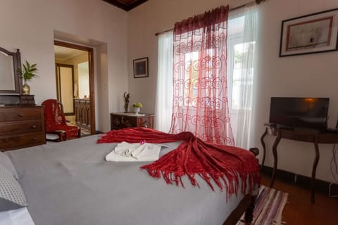 Classic bedroom on ground floor with beautiful views over the pool.