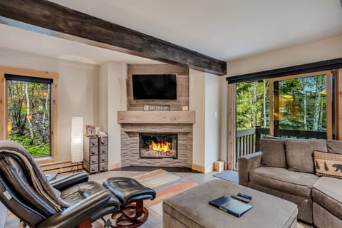 Living room with wood-burning fireplace