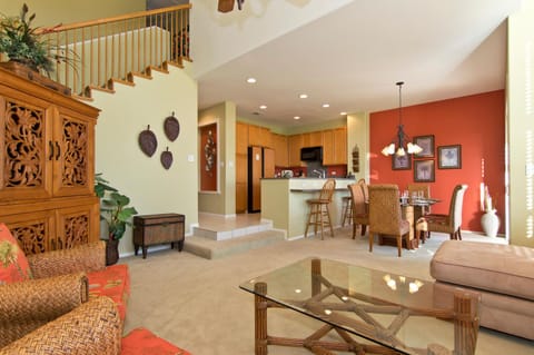 Open concept layout connects living room, dining, and kitchen