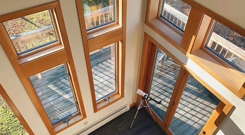 Large windows surrounding the living room