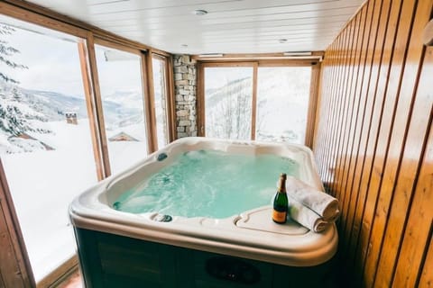 Relax in the lovely hot tub.