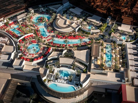 7 outdoor pools, open 9:00 AM to 4:00 PM, cabanas (surcharge)