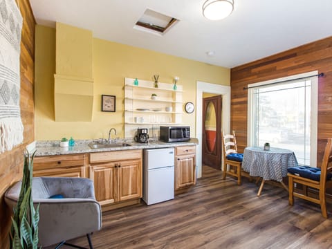 Cozy Corner Suite #3 has a kitchenette with microwave, coffee maker, toaster, mini-fridge, dishes, towel, sponge, soap and paper towels. 
Dining table for two to enjoy morning coffee and a little breakfast. 

++ADULTS ONLY++