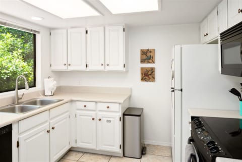 The kitchen is well equipped with modern appliances and amenities