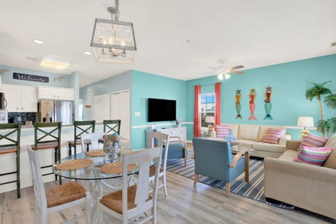 Open living room, dining, and kitchen