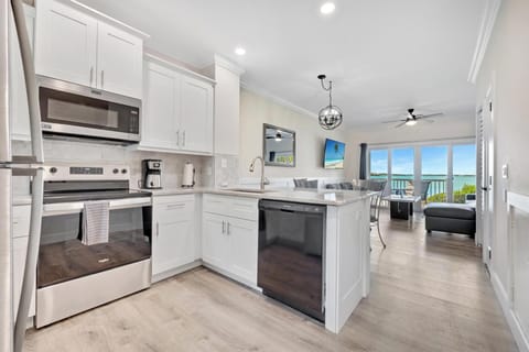Newly updated kitchen with granite and vinyl waterproof flooring