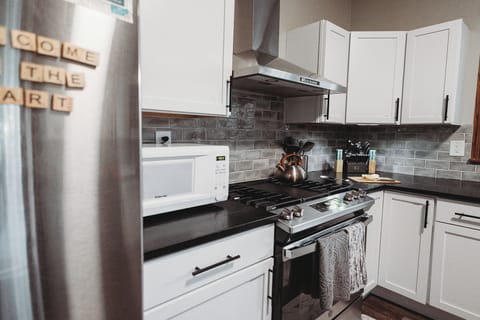 Microwave. Kettle. Utensils. Knives. Is anyone reading these captions?